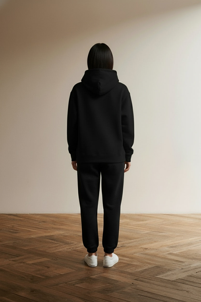 Back pose of the model wearing Love Like Jesus Graphic Christian Hoodies for Women Girls Oversized Long Sleeve Sweatshirts Drawstring Pockets Pullover Tops Graphic HoodiesA63 BlackL