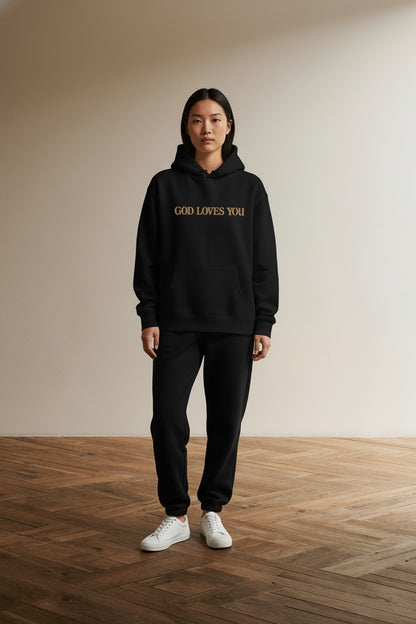 Full body view of the model wearing Love Like Jesus Graphic Christian Hoodies for Women Girls Oversized Long Sleeve Sweatshirts Drawstring Pockets Pullover Tops Graphic HoodiesA63 BlackL