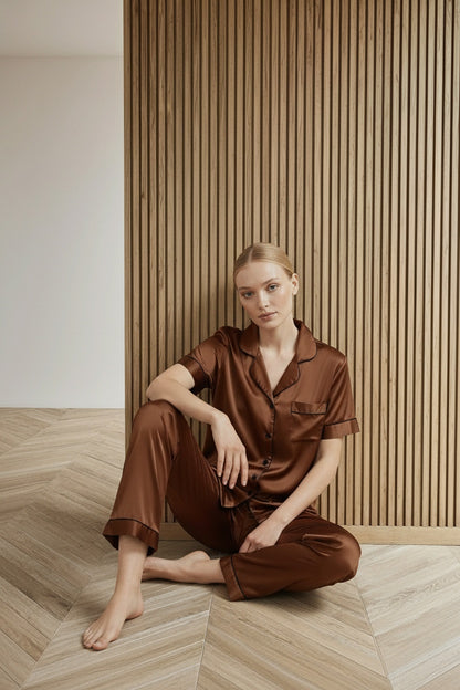 Model sitting while wearing KCW Pijama de Seda Para Mujer Satin 2 Piece Pajamas Set Button Down Silky Pjs Short Sleeve Sleepwear